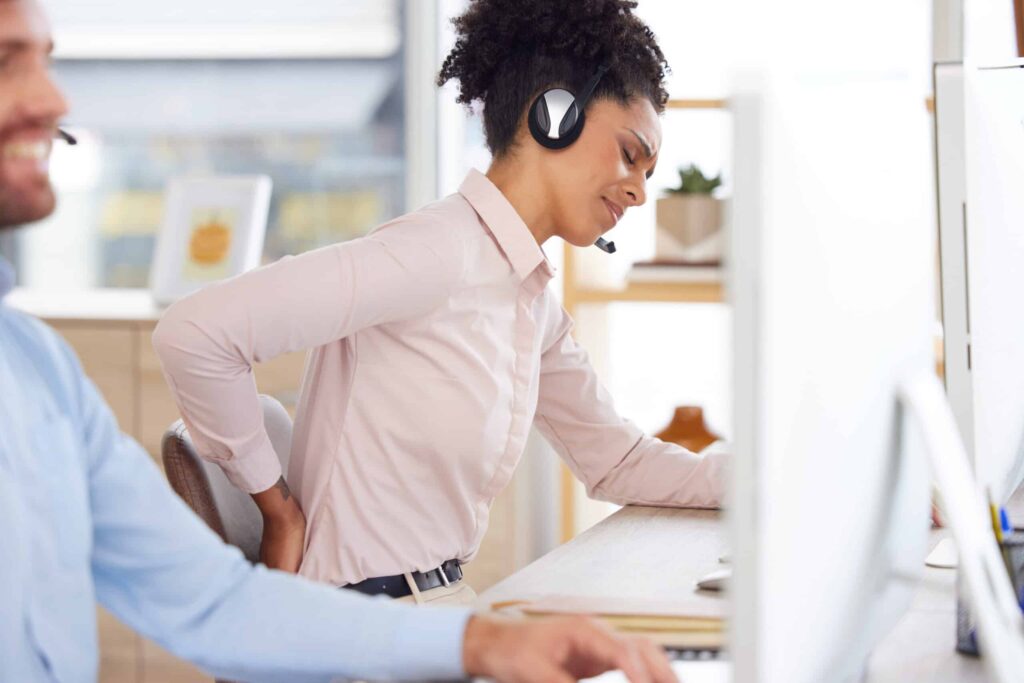 Sales agent frustrated with uncomfortable bad chair.